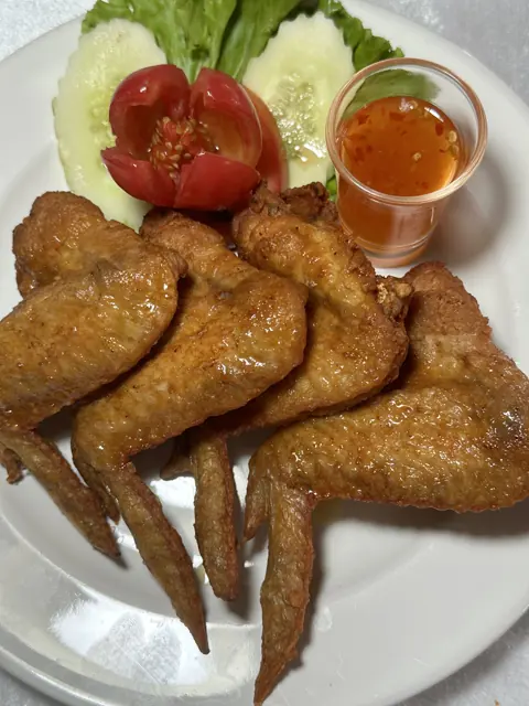 Chicken wings with salad and dipping sauce