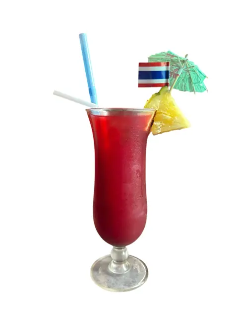 A tall red cocktail with tropical garnish