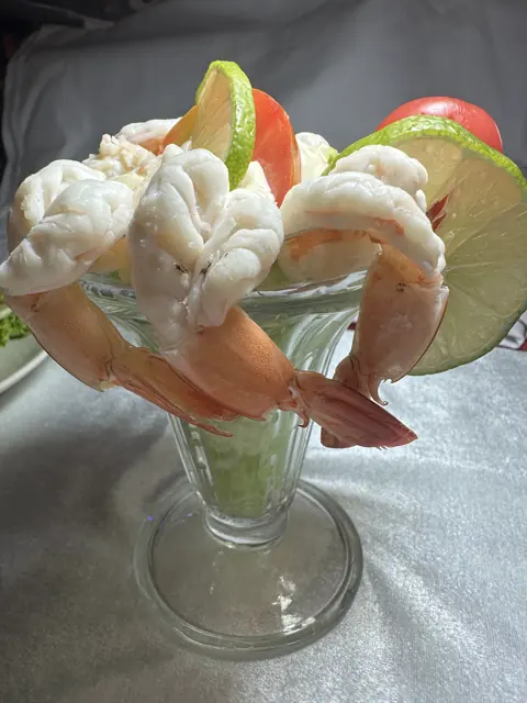 A shrimp cocktail served in a glass