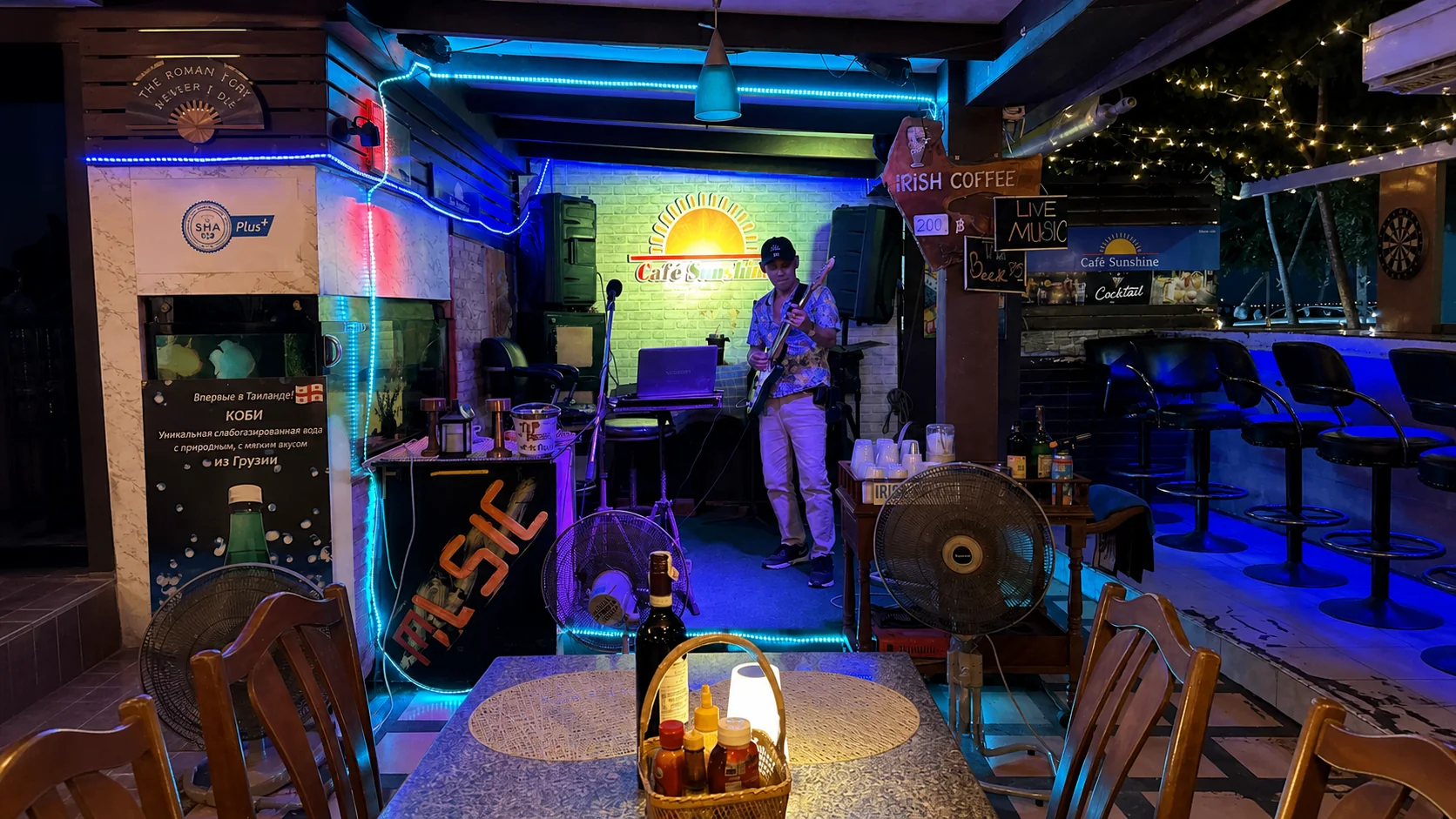 A musician performing on the Sunshine Cafe stage